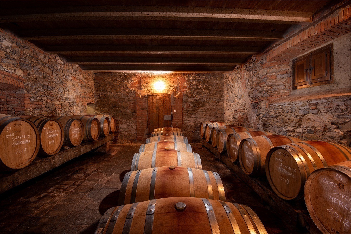 Wine barrels in the Il Falcone cellar